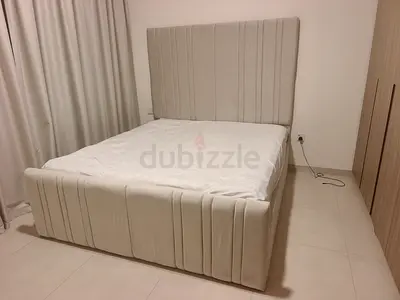 Queen upholstered bed frame with tall padded headboard - light beige