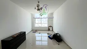 2BR for rent in Al Khan Sharjah sea view balcony master bedrooms built in wardrobes spacious layout 
