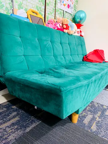 Green velvet convertible sofa bed - compact, good condition