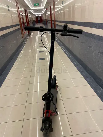 Used electric scooter - good condition, foldable handlebars 450 aed including charger
