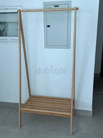 Bamboo clothes rack in very excellent condition, simple and practical.