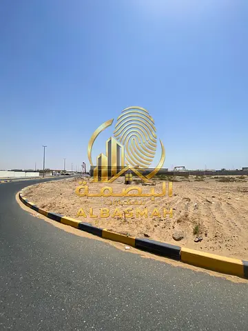Corner commercial land for sale in Sharjah Emirate, Al Malihah area, with an area of 3,347 square feet next to the new book fair.