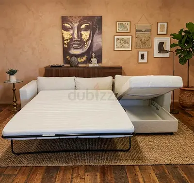 Light beige fabric sofa bed with storage pulls out to double bed
