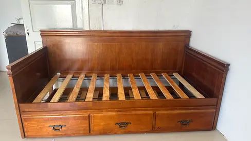 Bed with large storage drawer