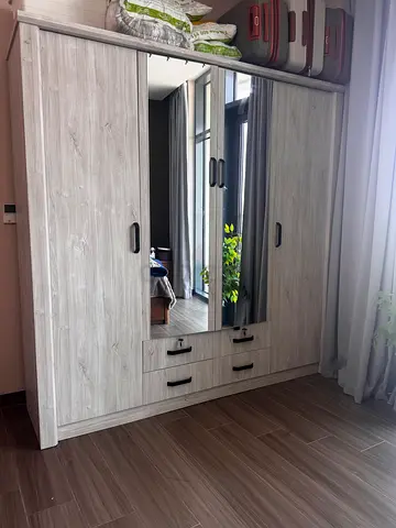 3-door mirrored wardrobe in light grey wood finish, excellent condition