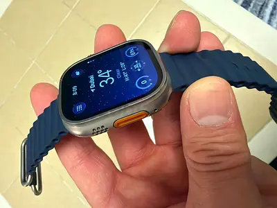 Used smartwatch with round-corner square display and silicone strap - good condition