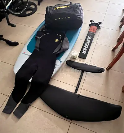 Complete foil board setup with Slingshot foil, mast, and wing
