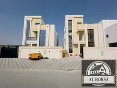 Villa for sale in Al Heliwa 2, Ajman. 5 master bedrooms, majlis, 3 living rooms, kitchen, and maid's