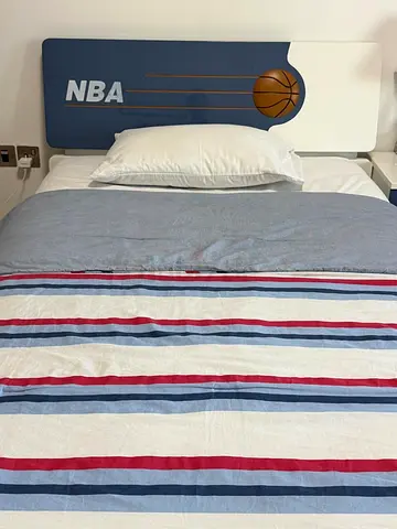 2-Single bed with NBA themed headboard - good condition with mattress included