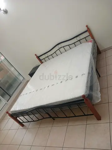Brand new King size wooden Steel bed including Mattress Available