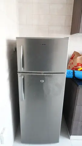 Medium-sized silver double-door refrigerator - good working condition
