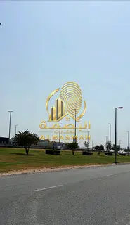 Commercial corner plot for sale in Al Hooshi area, Sharjah.