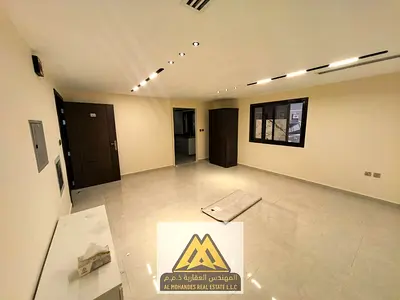 Annual studio for rent in Al Mowaihat 3, Ajman: Ground floor, semi-separate kitchen, central AC. Rent AED 22,000, 4 or 6 payments.