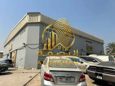 For sale: Industrial property in Industrial Area 2, Sharjah, consisting of 3 warehouses and 8 workers' accommodation rooms.