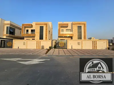 For sale in Al Helio 2, Ajman: a villa featuring 4 master bedrooms, a majlis, a living area, and a spacious kitchen with a maid's room.