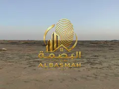For sale in Sharjah, Al Malha, Al Ruwaidat suburb, commercial land next to the new Expo site.