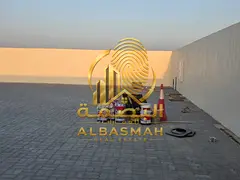 Yard for rent in Sajaa Industrial Area, Sharjah; area of 12,000 square feet, located on the se