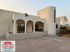 Ground-floor villa with four rooms and a garden in Al-Jazat.