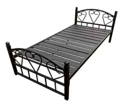 Single black metal bed frame with decorative headboard and footboard