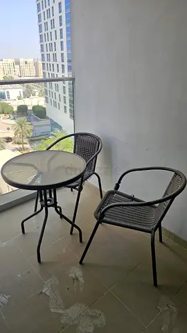 Metal outdoor bistro set — 2 chairs + round table
