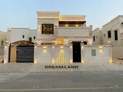 4-Bedroom Villa for Sale in Al Helio, Ajman Villa for Sale in Al Helio The kitchen is equipped with essential appliances and connects directly to th