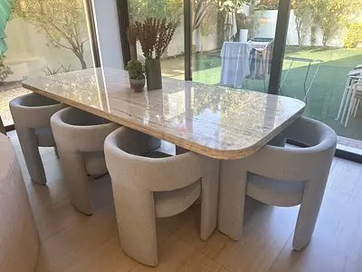 Travertine marble dining table with 8 upholstered chairs
