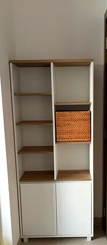 Tall white and wood storage cabinet with woven basket - good condition