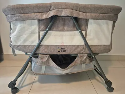 Crib in greige color — good condition
