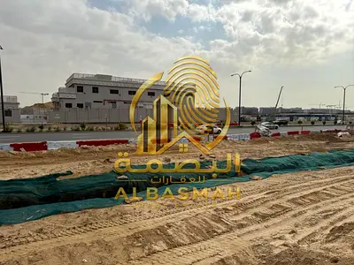 Commercial land for sale in Sharjah, Al Muwaileh Al Falah, on a main road, freehold ownership for Arabs, with an installment plan.