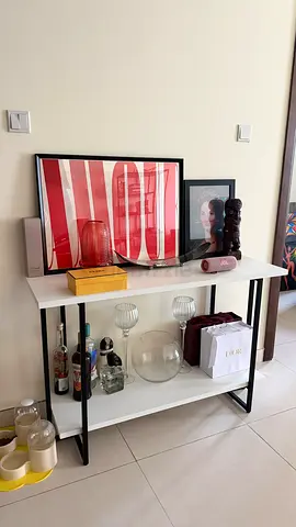 Minimalist Console Table with Decorative Items - White Top, Black Frame