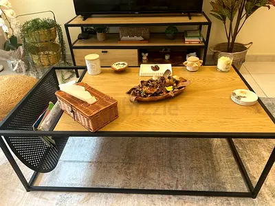 Modern industrial coffee table with oak top and black metal frame