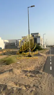 Two corner plots for sale in Al-Hawshi, new development, with installments over three years, freehol