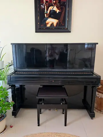 Upright antique piano. Good Condition with original bench