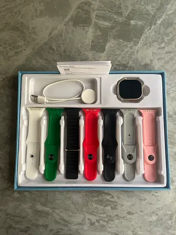 Smartwatch with 7 Interchangeable Bands and Charger - Unused