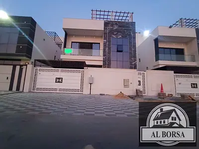 For rent in Al Helio 2, Ajman: A 7-bedroom villa featuring a majlis, a living area, a spacious kitchen, and a maid's room. First-time occupancy.