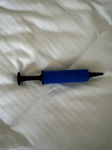 Small handheld air pump for inflatable balls and toys - used