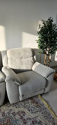 Single beige fabric recliner in good condition