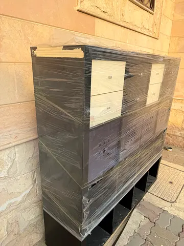 Dark wood storage cabinet with drawers — good condition