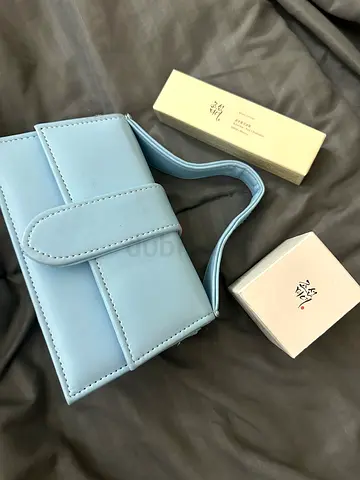 Light blue small women's handbag with top handle — like new