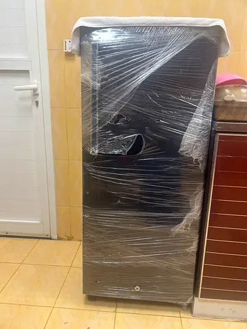Used Black Double-Door Refrigerator in Good Working Condition medium size.
