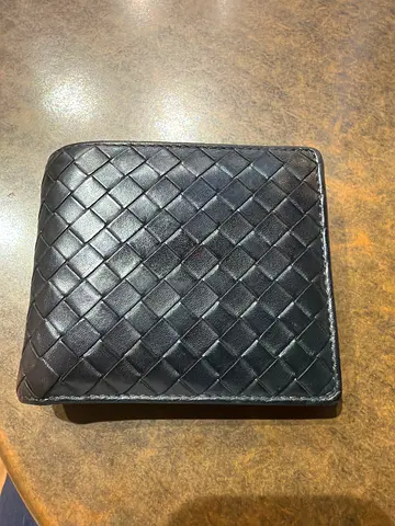 Black woven leather bi-fold men's wallet - good used condition