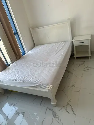 White single bed frame with mattress and bedside table - good condition