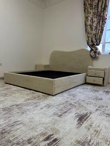 Beige upholstered double bed frame with matching bedside tables - good condition