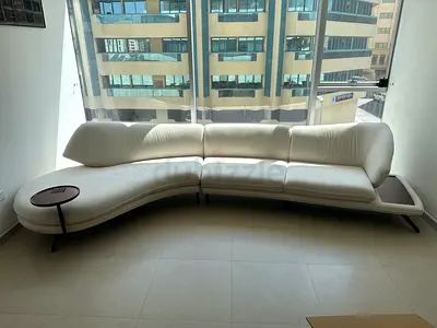 Has to go today. 2 piece Modern Curved White Fabric Sofa with Built-in Side Table.