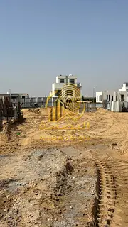 Commercial land for sale in Al-Houshi neighborhood on Mleiha Street directly, area 6,006 sq ft, free