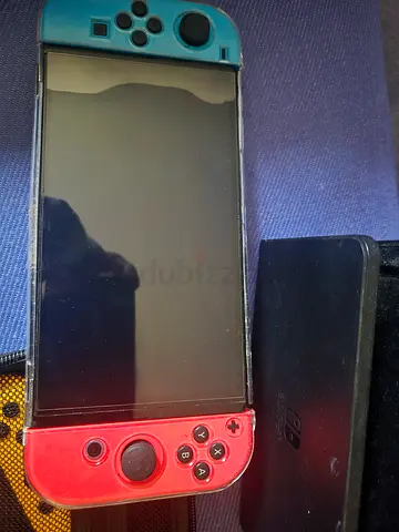 Nintendo Switch oled Console with Neon Blue/Red Joy-Cons - Good Condition with 6games