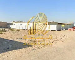 Property for sale consisting of two walled plots in Industrial Area 12, Sharjah.