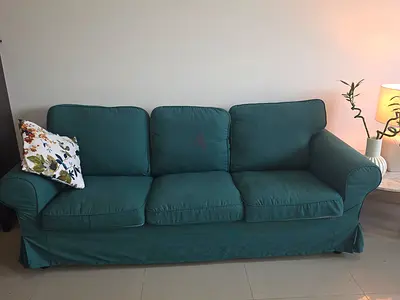 3-seater green fabric sofa with removable cushions