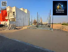 Residential plot for sale in a prime location in Al Helio 2, Ajman. It is ready for construction, wi