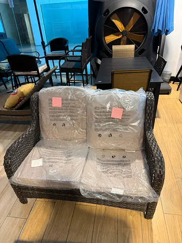 Brown Wicker Outdoor Patio Loveseat with Beige Cushions